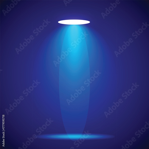 Spotlight illuminates a dark space creating dramatic lighting effects
