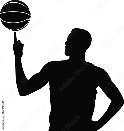 Silhouette of a male athlete spinning a basketball on his finger