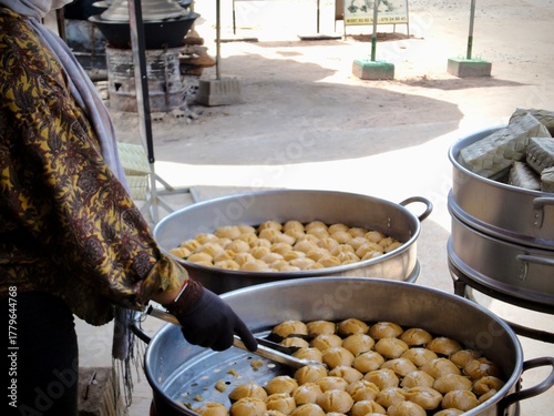 Traditional Cambodian steamed cakes being prepared at local market