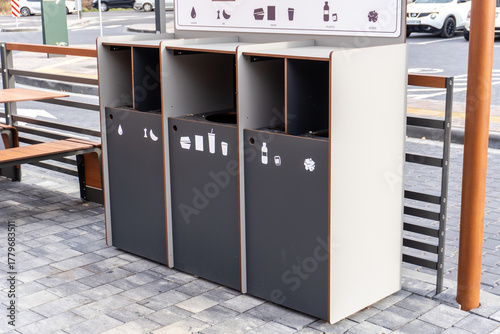 Papier peint Modern recycling bins at a public space showing clear waste segregation for effi