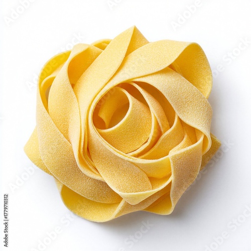 Uncooked tagliatelle pasta nest forming rose shape