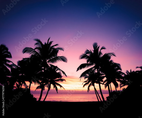 Tropical Palm Trees Silhouetted Against Vibrant Sunset Sky