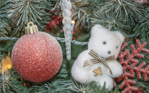 Christmas decorations - a shiny ball and a fluffy teddy bear