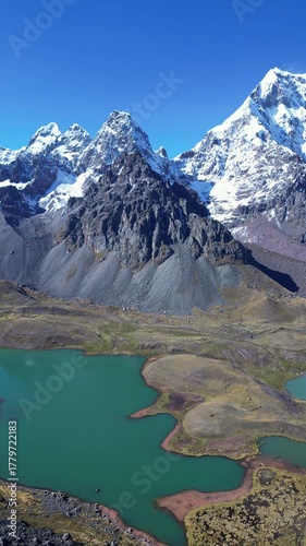 Ausangate, Peru: Panoramic drone footage from trekking to seven lakes in Ausangate, mountain in Ocongate district near Cusco, Peru with mountain peak in the background