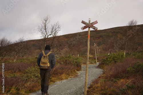 A traveler following the mountain trail