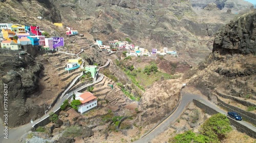 CAPE VERDE - 9.4.2025 - Good aerial tilt up colorful housing on the hills of Cape Verde's Fontainhas village.