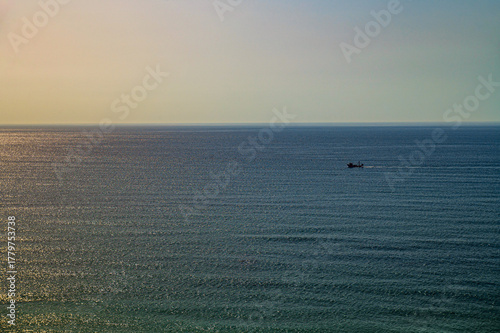 a lonely boat at sea