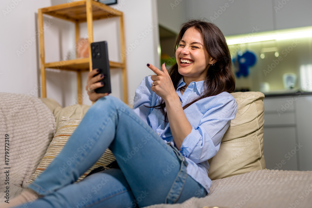 Obraz premium Young woman on video call at home