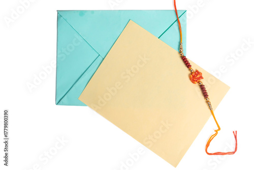 Raksha Bandhan Rakhi with envelope and card celebrating Indian tradition.