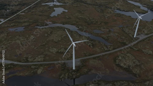 Aerial shot of onshore windmills in wild Norwegian countryside