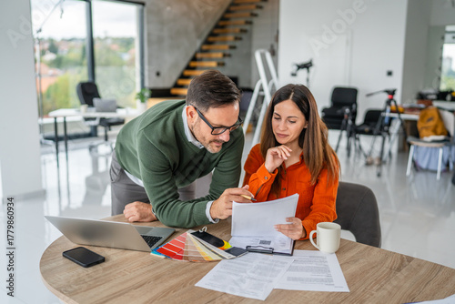 Couple planning home renovation budget and interior design