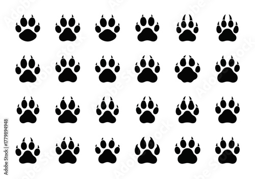 Set of black animal paw print icons. Vector illustration collection of dog, wolf, or predator tracks isolated on a white background