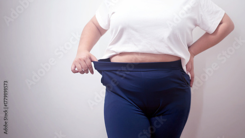 Fotografie Attractive picture, close up half body of a fat woman, showing the proportions of her body that are obese