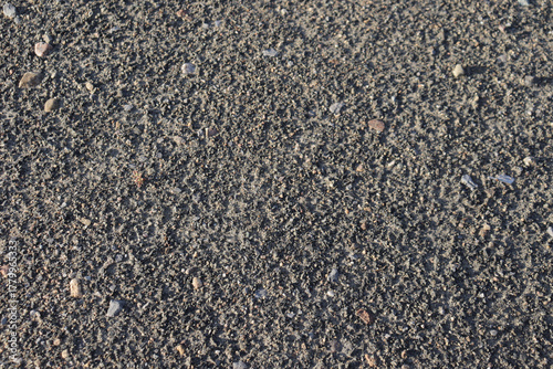 Fototapeta Naklejka Na Ścianę i Meble -  Ground texture background with sand and little rocks. Dirty surface and gravel.