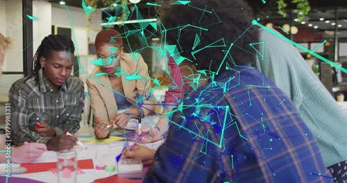 Design team starting drawing sharing pens, pointing notes for UX, teal network overlay drifting