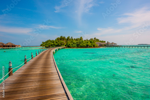 Fototapeta Naklejka Na Ścianę i Meble -  Pathway to bungalows. Summer vacation, holiday amazing nature. Relax paradise, Maldives. Tropical island beach landscape exotic shore coast. Tranquil closeup calm sea water waves with palm trees.