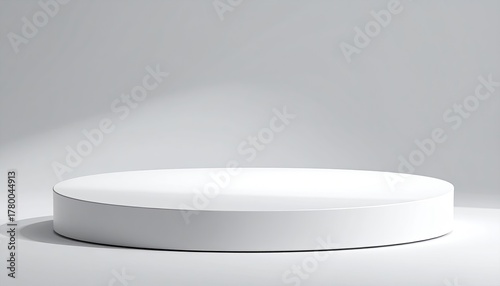 Cylindrical white pedestal in soft, bright lighting