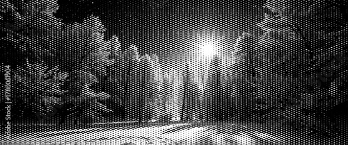 Black and white infrared snowy winter forest landscape with old grunge film strip effect.