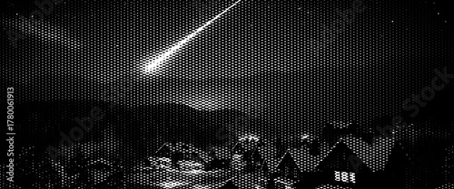 Star trails trace lines across the dark night sky with clouds over the winter landscape.