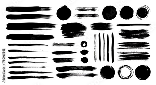 Various black brush strokes and circles on a white background.