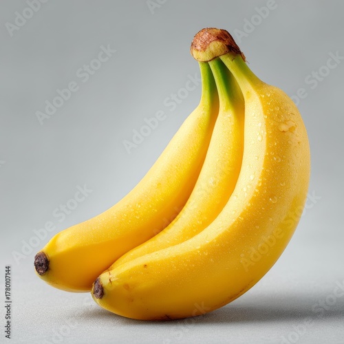 Three Ripe Bananas with Water Drops
