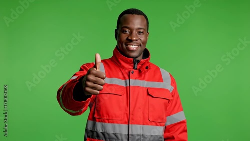 Positive Black Worker Displaying Approval and Greetings in Studio with Green Screen