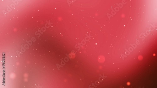 Blurred red background with white sparkles and bokeh suitable for festive designs, holiday greetings, christmas themes, abstract backgrounds, and special occasions.