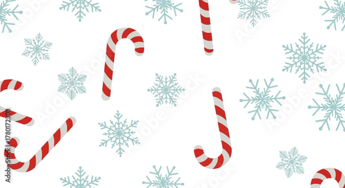 Festive pattern with redwhite candy canes and pale blue snowflakes on a white background