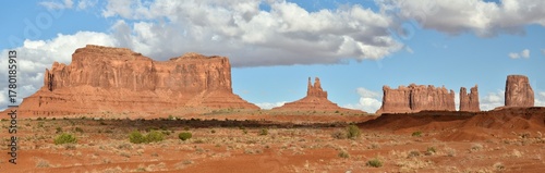 Landscape of Monument Valley in Arizona, showing the Saddleback Butte, King on His Throne, Stagecoach Butte, and Castle Rock.