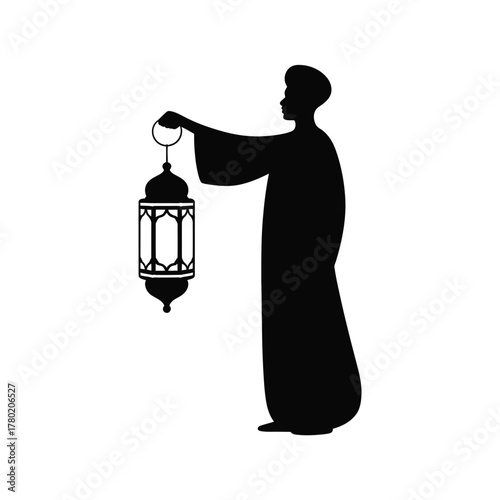 Silhouette of a person holding a traditional lantern