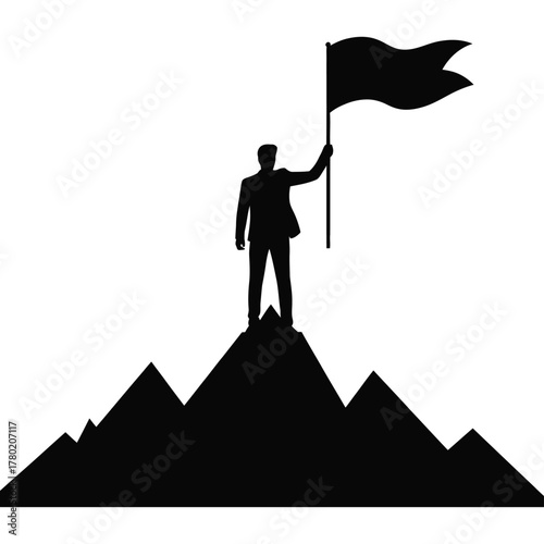 Silhouette of a businessman planting a flag on a mountain peak