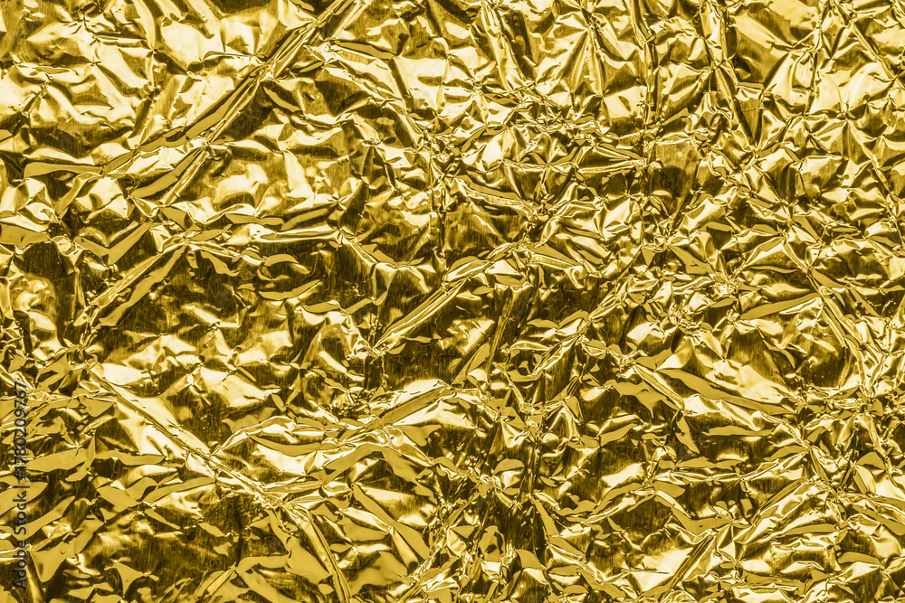 Obraz premium Luxury shiny metallic golden foil crumpled texture background