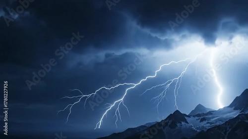Showcasing the fleeting, brilliant beauty of a single, intricate lightning bolt as it momentarily fractures the darkness above a rugged, untouched terrain.