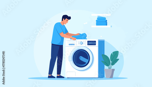 Man Folding Clean Laundry Next to Modern Washing Machine.