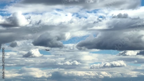 An airplane landing during the day, an airplane over the city from the side view. High quality 4k