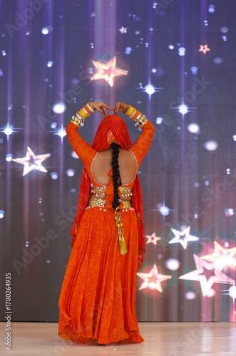 Portrait of an unidentified female artist performing classical dance in ethnic indian clothes.