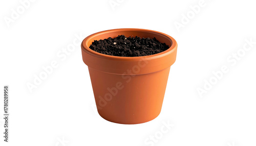 Terracotta pot filled with dark soil, isolated against a black background, hinting at cultivation and beginnings