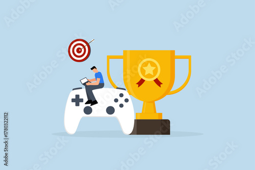 Gamification, man with computer laptop on game joystick with trophy award.