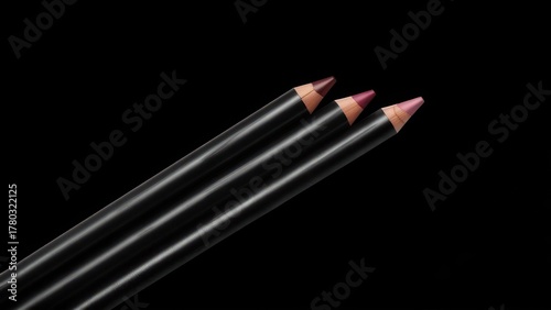 Three lip liners of varying shades