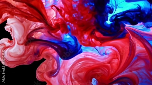 Dynamic red and blue liquid forms swirling abstract patterns in water, moving gracefully and blending hues to create fluid artistic motion with smooth transitions