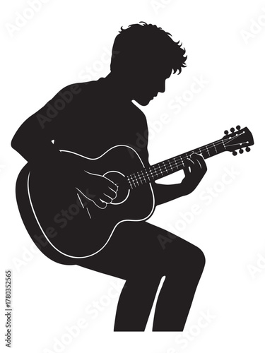 Silhouette of a musician passionately playing an acoustic guitar in profile