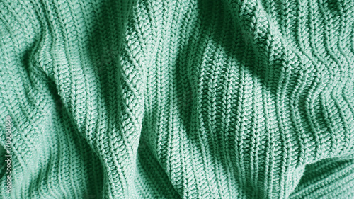 Fotografija Close up of a knitted blanket or sweater texture in a vibrant mint, emerald, or turquoise color