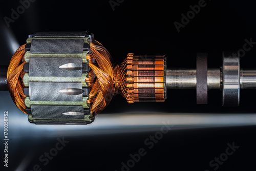 Electric motor rotor with metal structure and copper windings on dark background, futuristic industrial technology concept