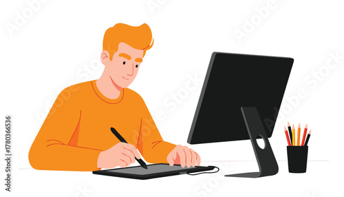 Young man with orange shirt and blond hair using a graphic tablet and stylus to draw on a computer
