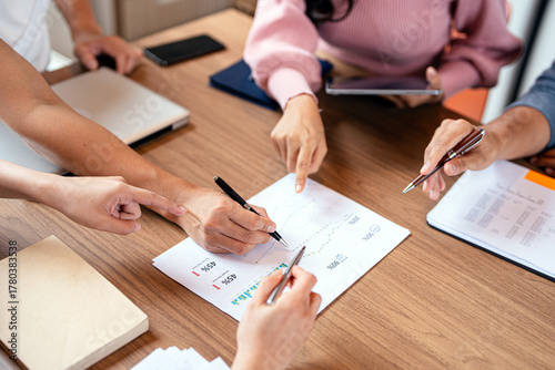 Wallpaper Mural group of colleagues in formal clothing discussing business ideas while gathering at table in modern office and working together Torontodigital.ca