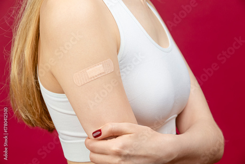 Wallpaper Mural Medical Concepts. Closeup Portrait of One Winsome Blond Caucasian Woman With Crossed Hands Posing With Hand Bandaid Over Red Torontodigital.ca