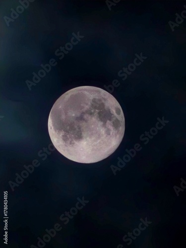 full moon over blue sky