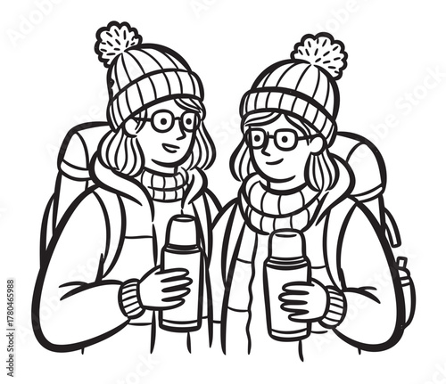 Two young caucasian females, wearing winter clothing and backpacks, holding thermos bottles, smiling as they prepare for a hiking adventure.