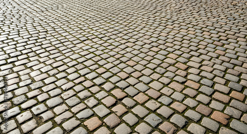 Fototapeta Naklejka Na Ścianę i Meble -  Old cobblestone street pavement for concept of travel, history, or European city