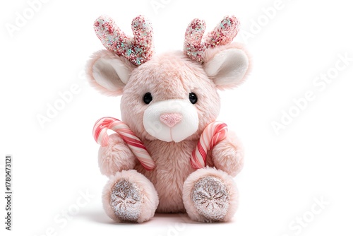 A cute plush reindeer with candy canes sits on a white background.